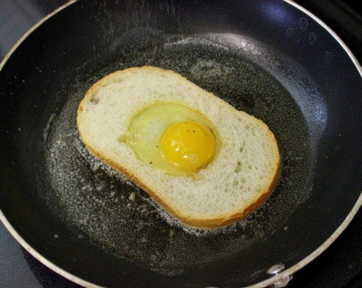 step 4 Crack one Eggland's Best Classic Eggs (4) into the center of each slice of bread. Season with Salt (to taste) and Ground Black Pepper (to taste).