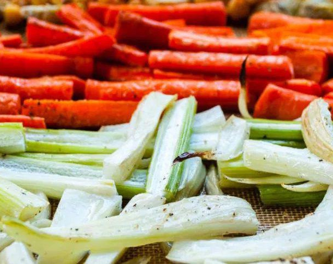 step 3 Spread Carrots (4), Cauliflower (1/2 head), Red Chili Pepper (1/2), Fennel Bulb (1), Red Onion (1/2), and Garlic (2 cloves) in a single layer on a large baking sheet. Drizzle with Olive Oil (4 Tbsp) and season with Salt (to taste) and Ground Black Pepper (to taste).