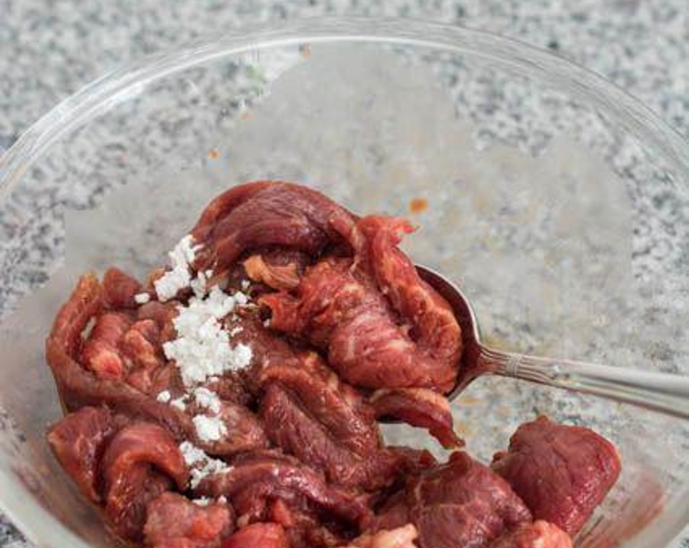 step 1 Pour Soy Sauce (2 tsp) and Corn Starch (2 tsp) over the Sirloin Steak (1.5 lb), then stir till the beef is well coated. Allow to marinate at room temperature for about 15 minutes.