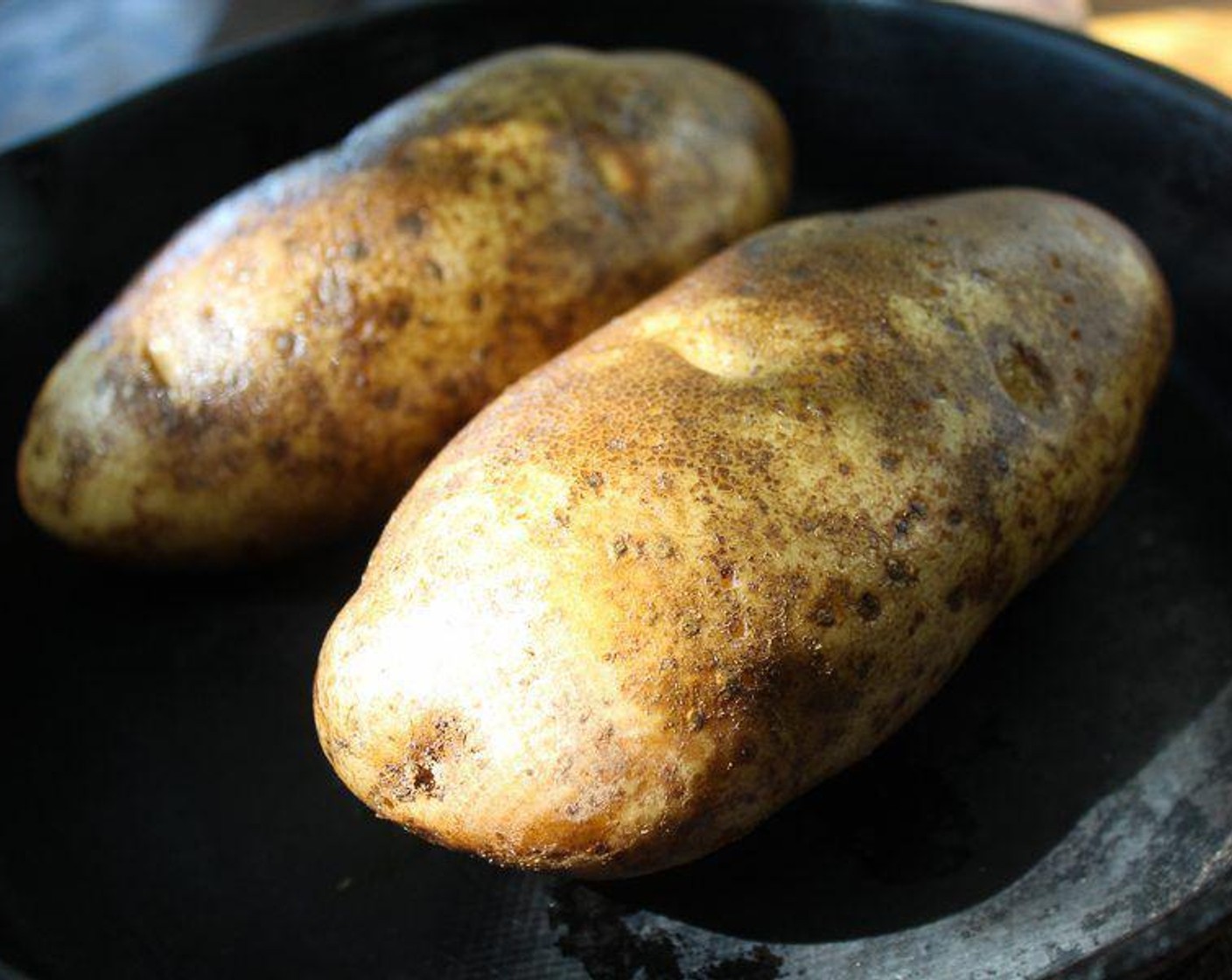 step 2 Wash and scrub the Potatoes (2), then prick all over several times with a fork. Rub each potato with Vegetable Oil (1 tsp).